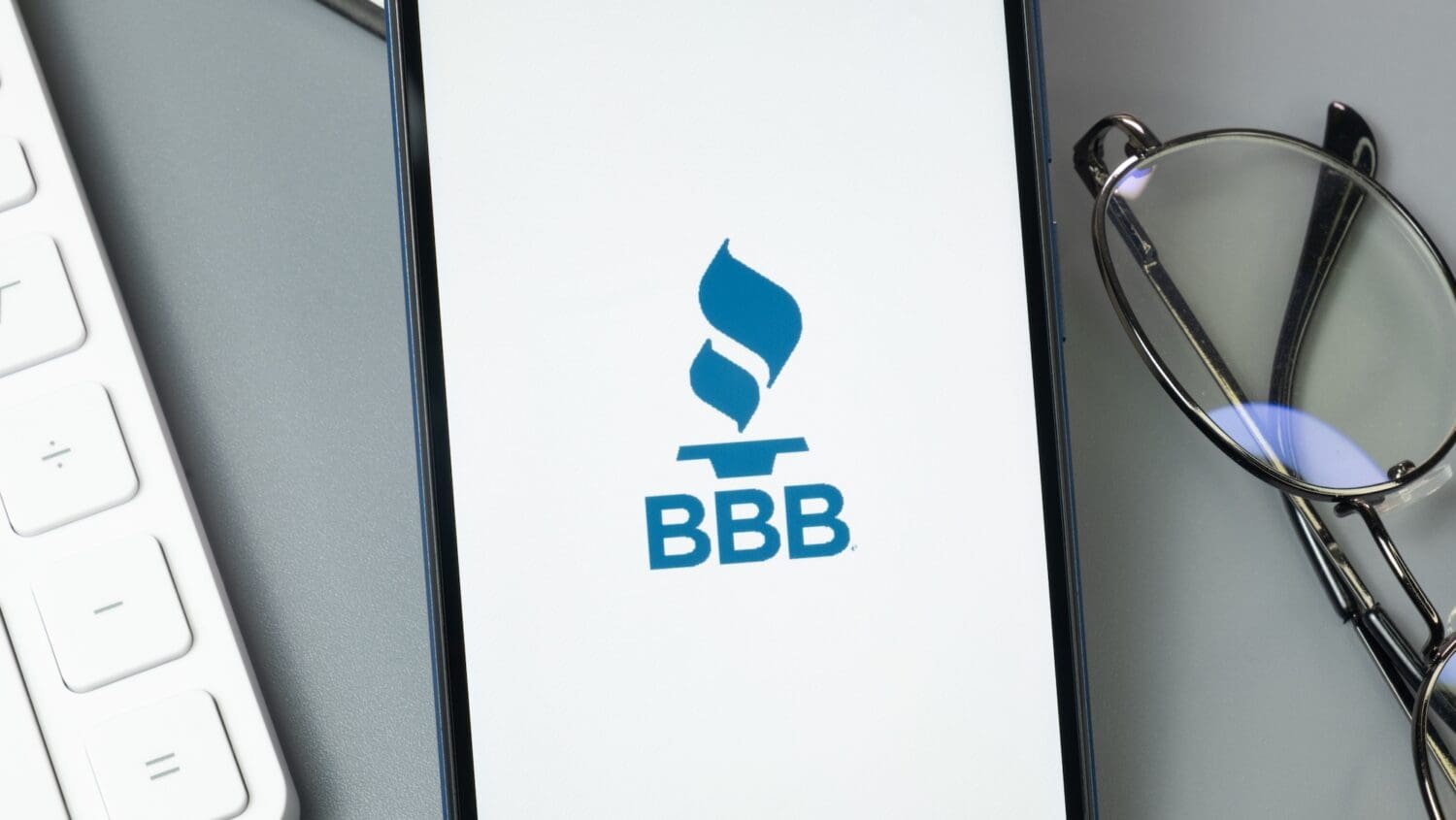 Better Business Bureau BBB Logo on Phone Screen, Company Icon on Display.